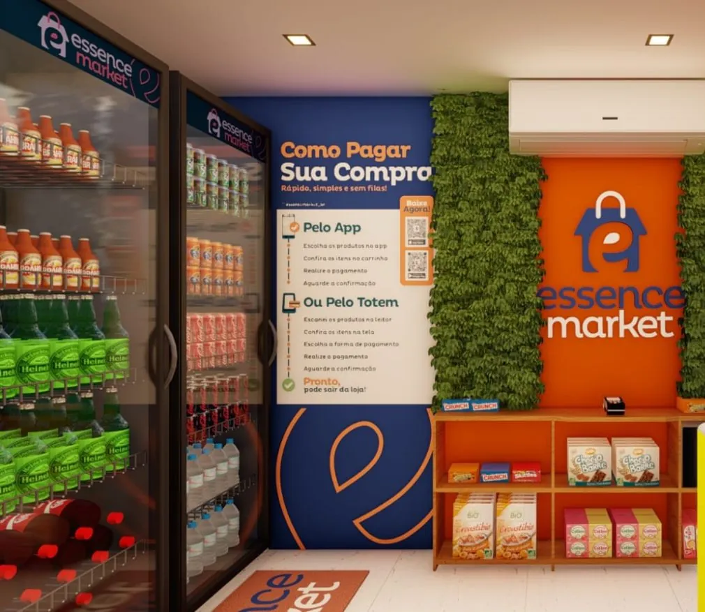 Interior de um minimercado autônomo Essence Market com instruções de pagamento pelo aplicativo ou totem